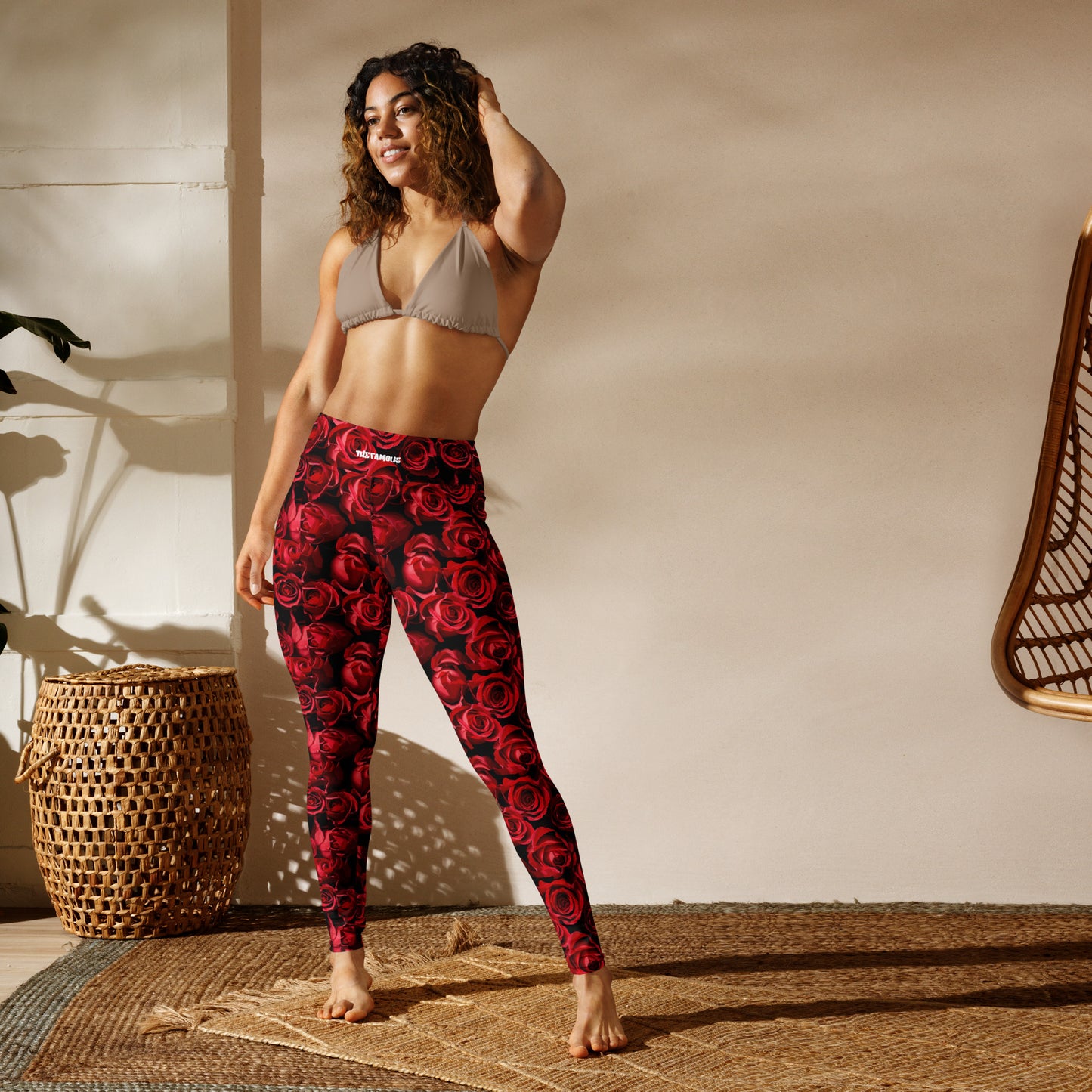 Fashionable high-waisted leggings with a striking red rose camouflage print.A 2025 activewear trend