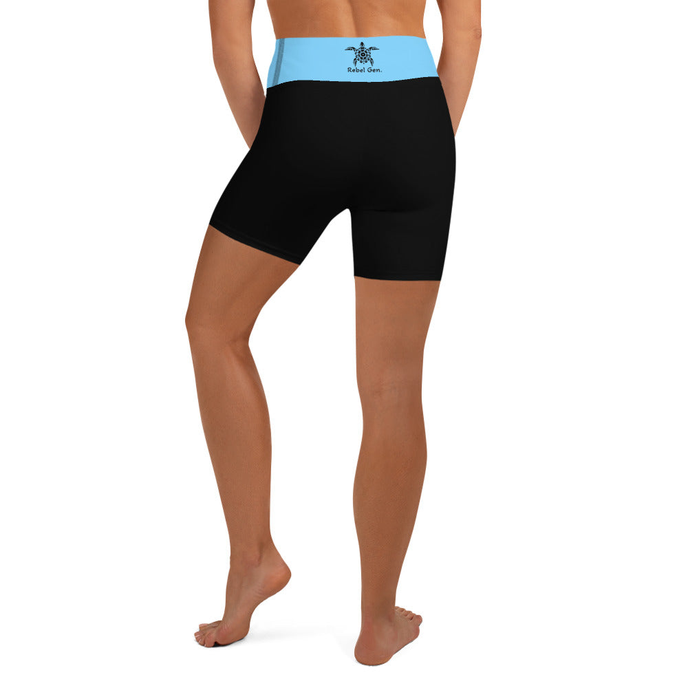 Activewear for women. High waisted short black and turquoise with surfer tattoos.
