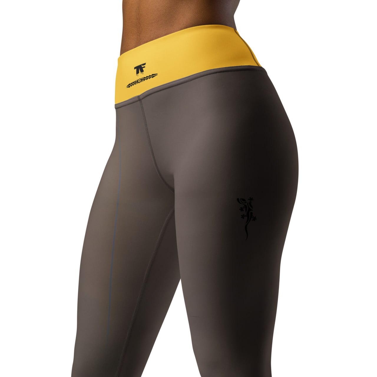 Activewear for women. High waisted leggings brown and yellow with superb back tattoos.