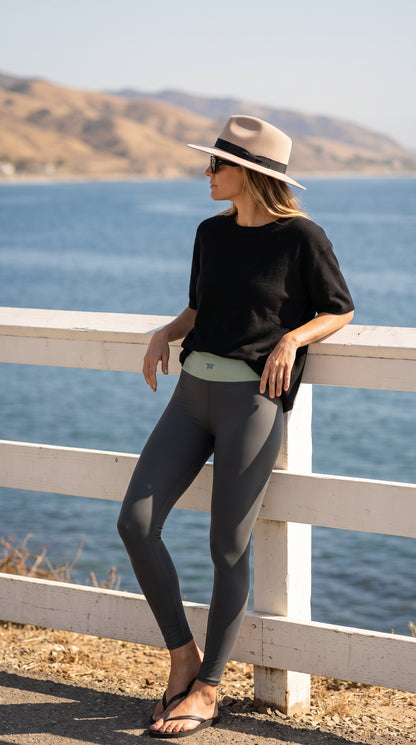 Woman walking in NYC with the leggings Dark Grey & Matcha | Activewear for women to wear beyond the gym 